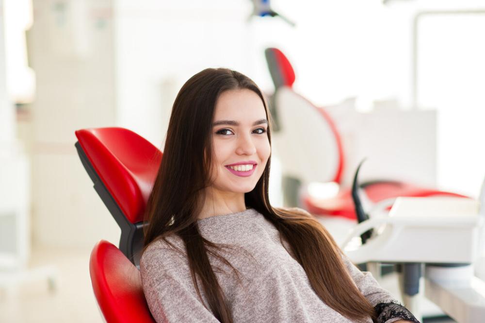 woman sitting in dental chair in lincoln ne