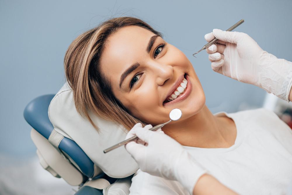 woman smiling in a dental chair