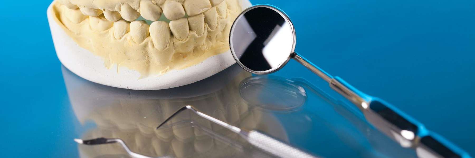 teeth next to dental tools