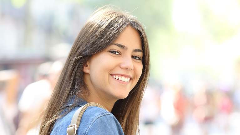 young woman smiling at the camera in lincoln ne