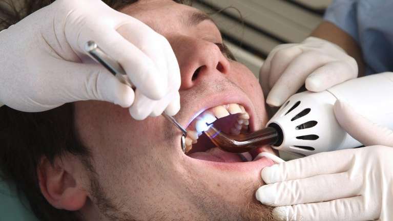 man getting a dental filling in Lincoln ne
