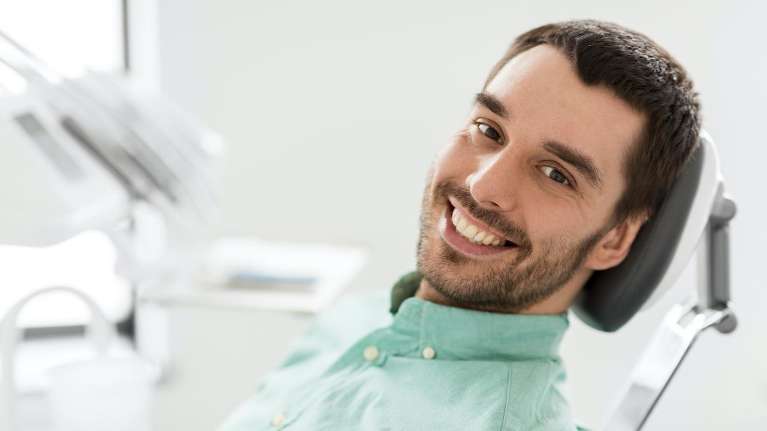 lincoln man smiling in dental chair
