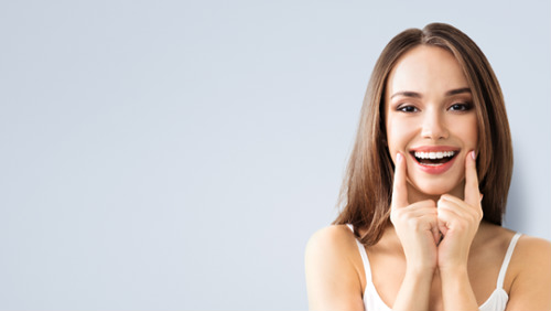 Woman pointing at smile 