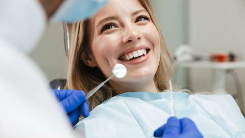 young woman during her dental checkup in lincoln ne