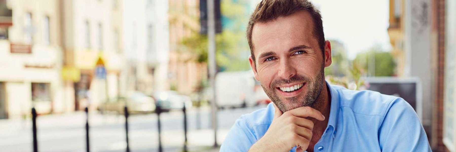 smiling man outside of his lincoln ne dentist