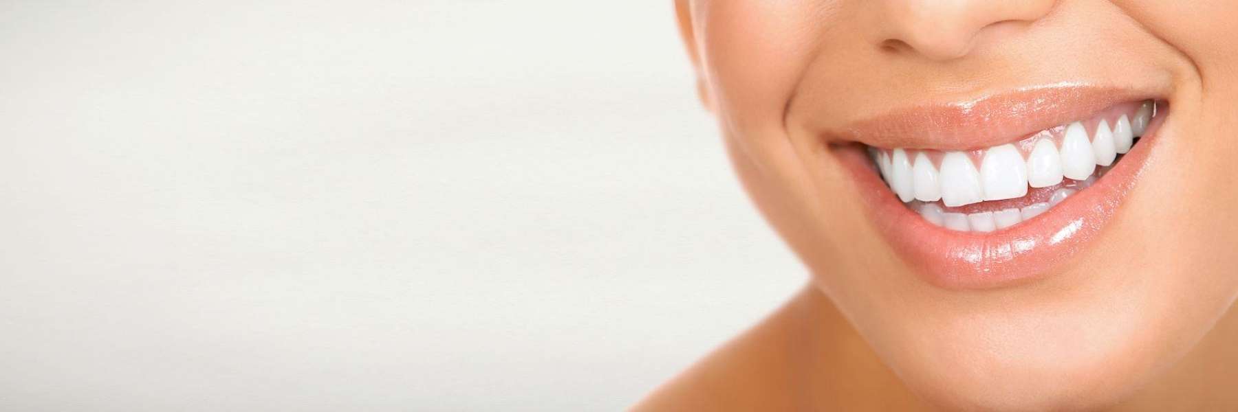 close up of woman's straight smile after using clear correct aligners 