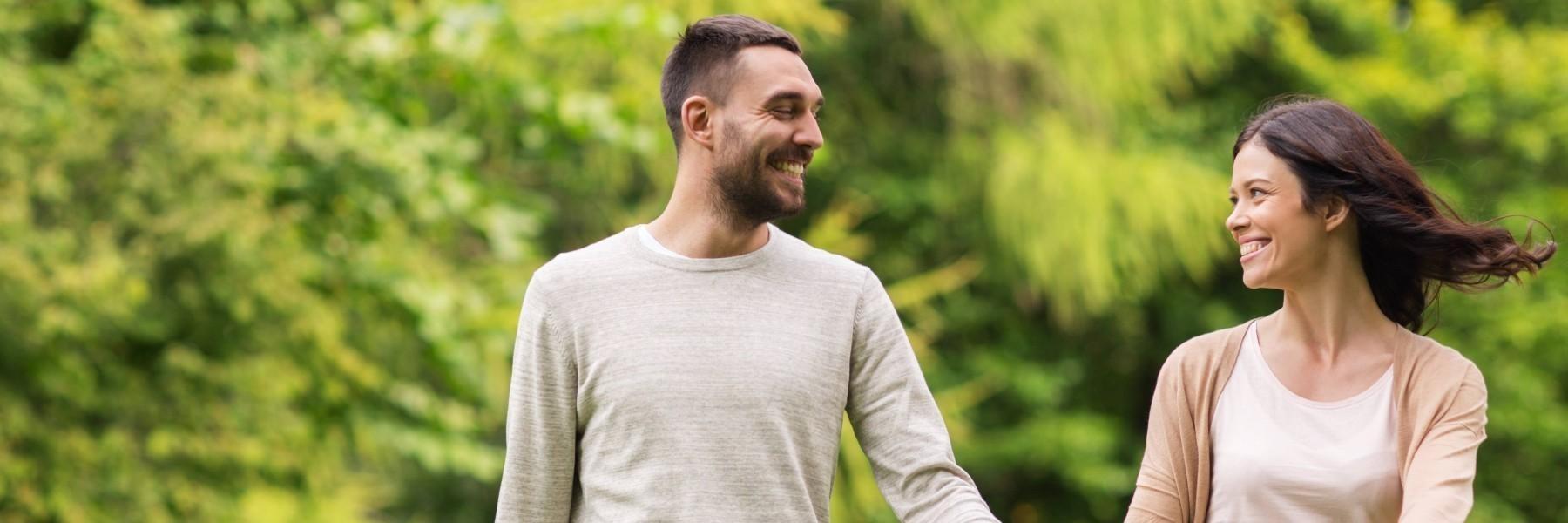 lincoln Couple Smiling while walking in a park